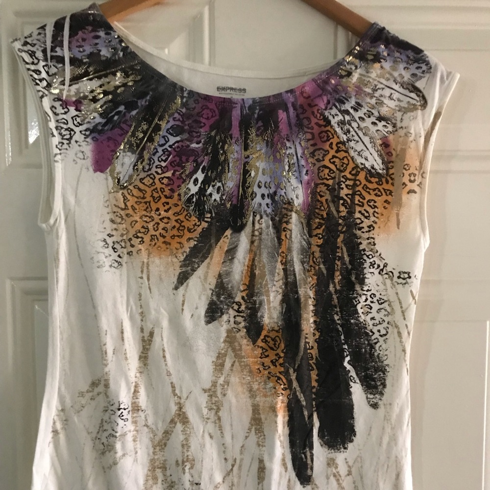 White sleeveless top with print on front